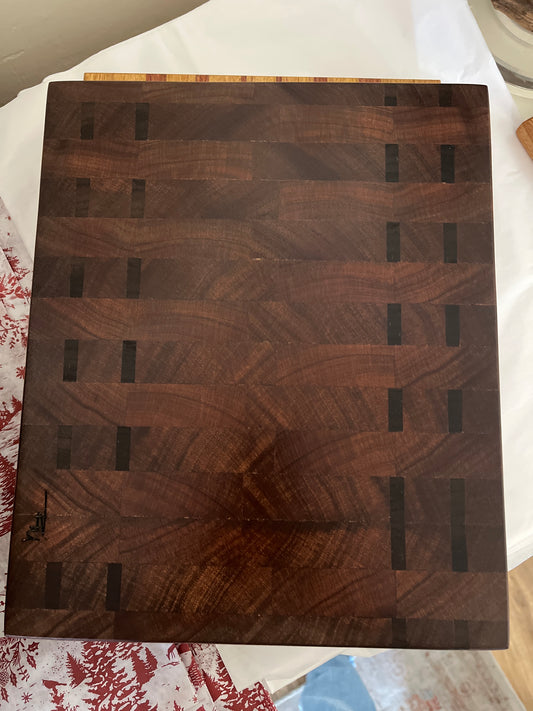 Black American walnut, Patagonia walnut, Padauk & mahogany bar cutting board by Rick Morse